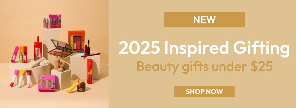 Beauty gift set with colourful lip products, palettes, and packaging on display. Text: "2025 Inspired Gifting, Beauty gifts under $25, Shop Now."
