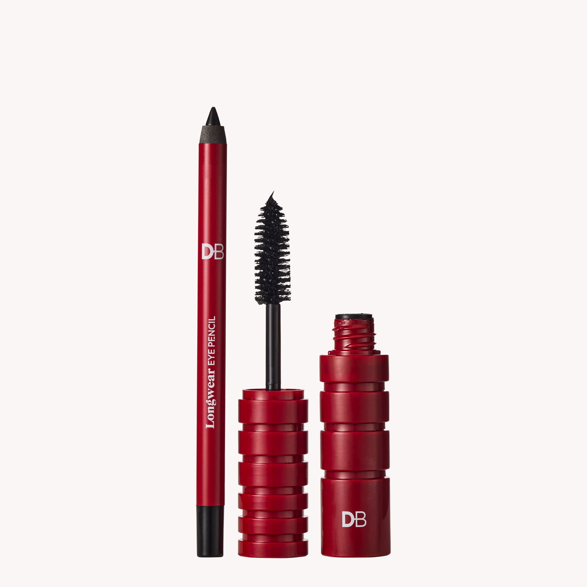 Red makeup products including an eyeliner pencil and mascara on a white background