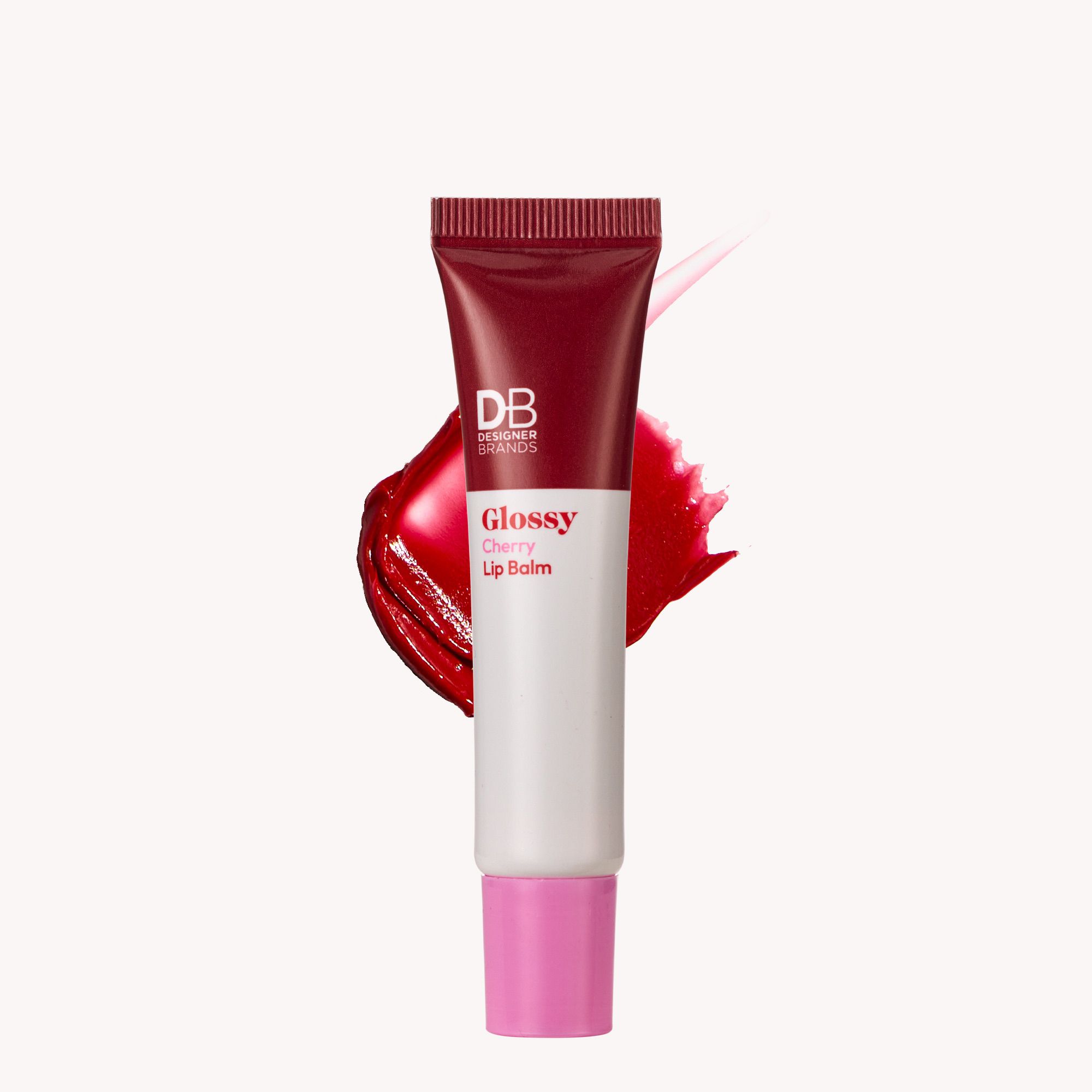 Red and white lip balm tube with pink cap on a white background