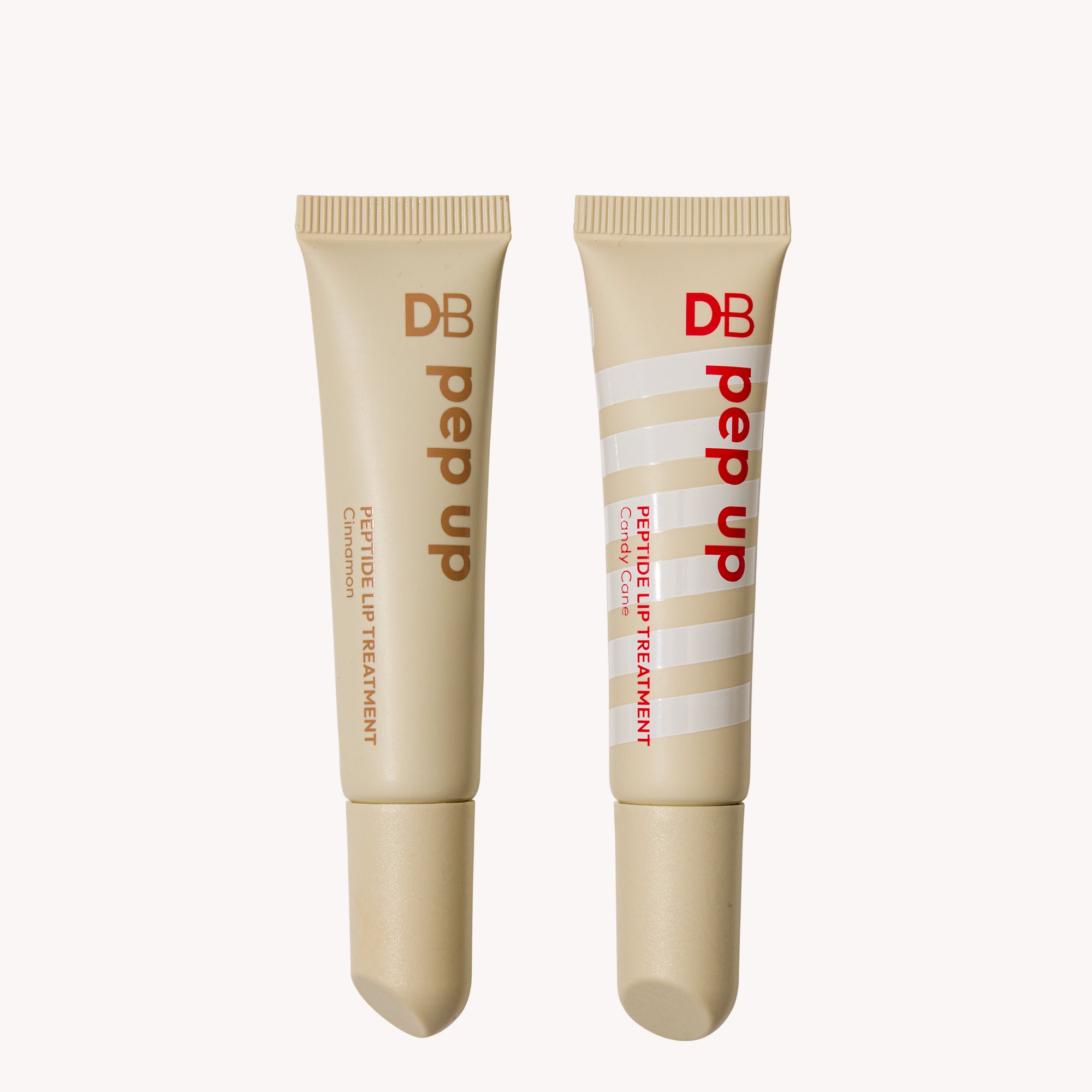 Two DB Pep Up lip treatment tubes on a white background