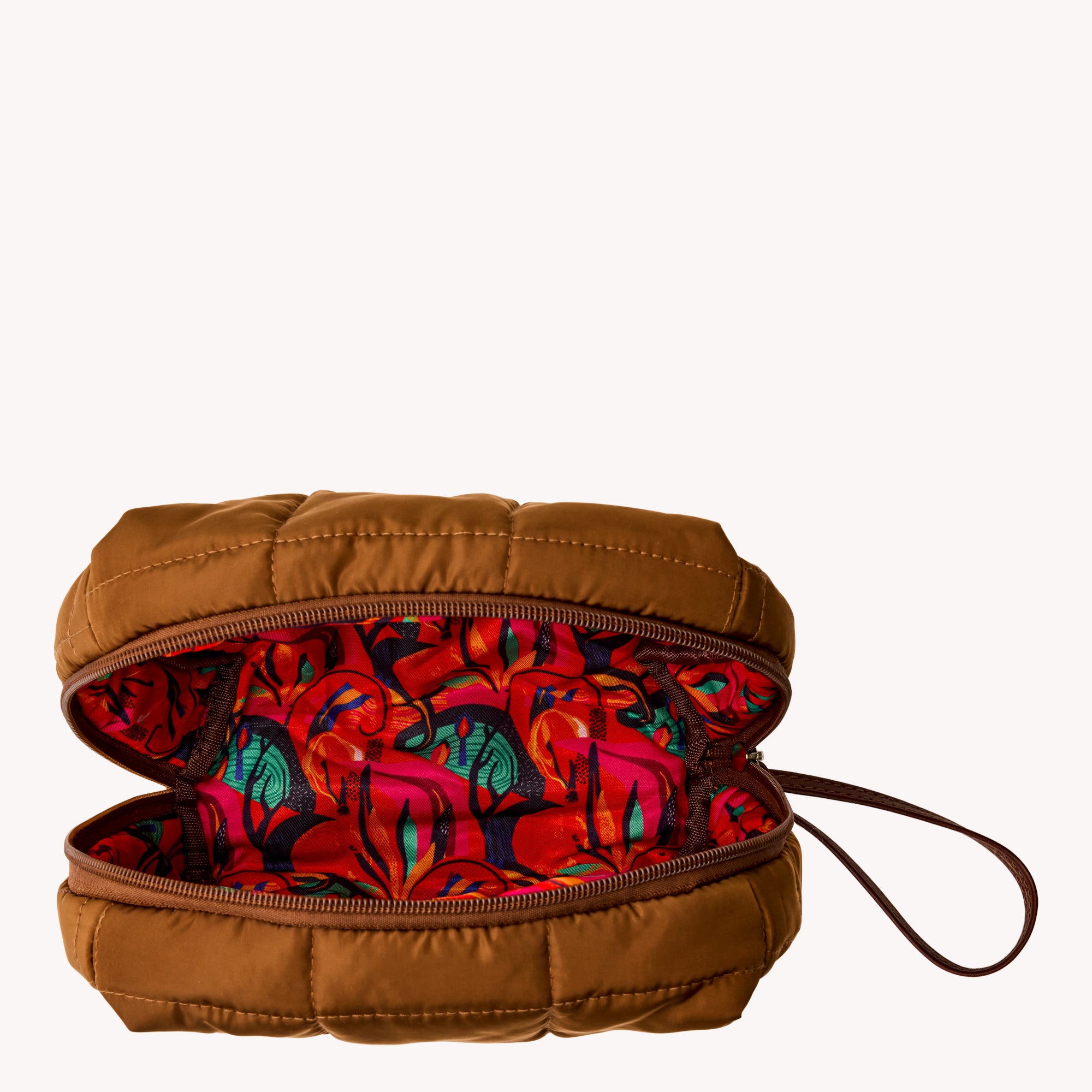 Brown quilted bag with a colorful interior on a white background