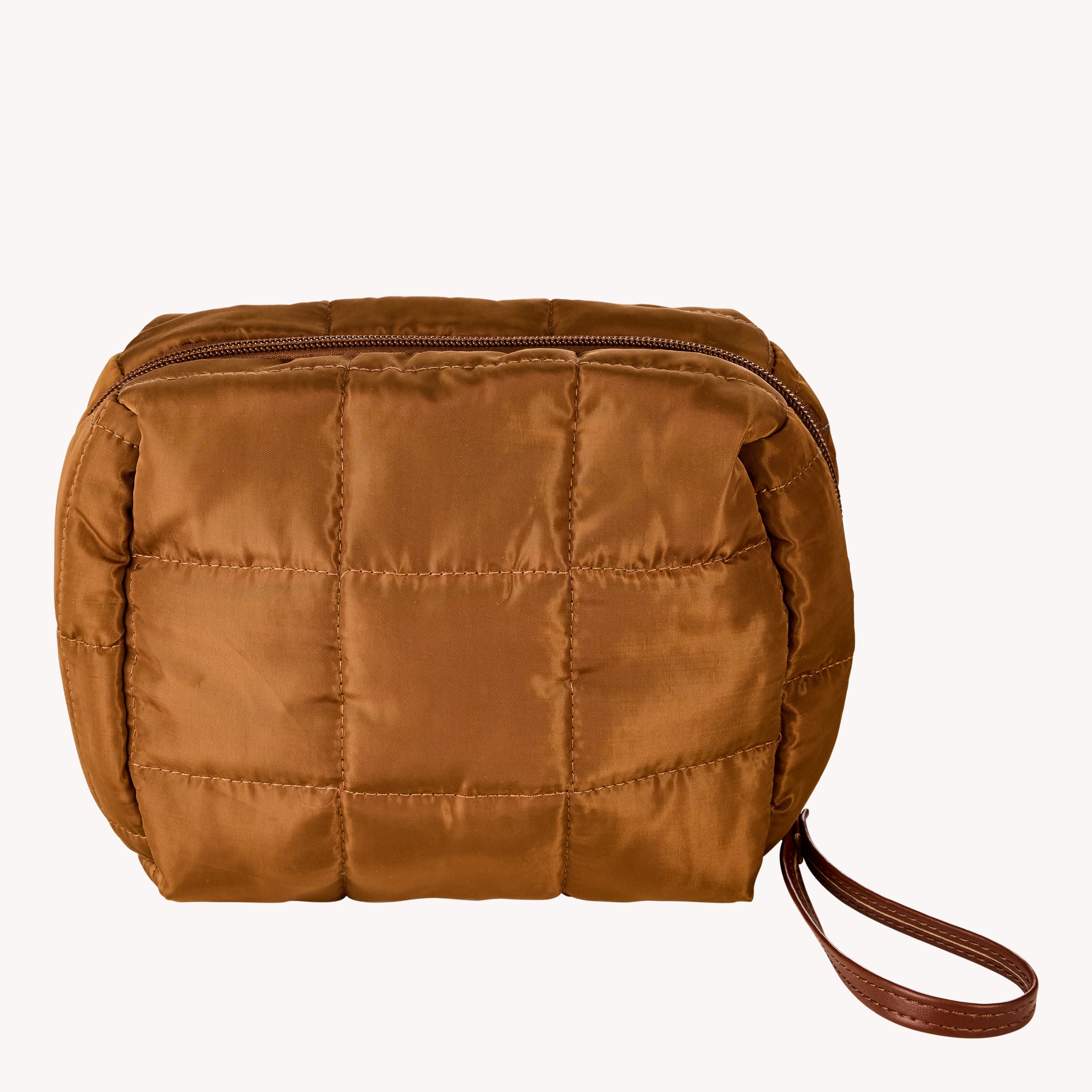 Brown quilted pouch with a strap on a white background
