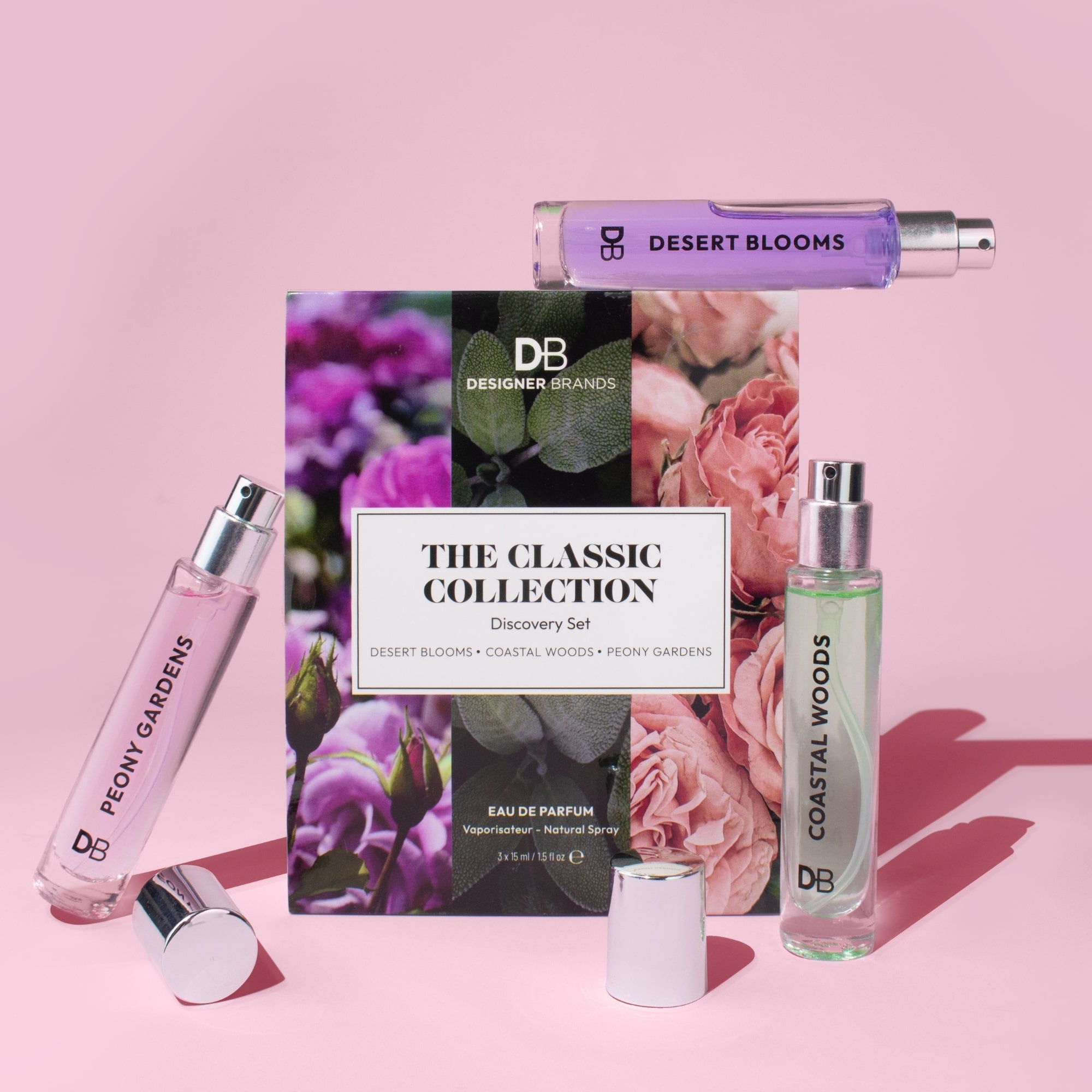 Perfume set with 'Desert Blooms' and 'Coastal Woods' on a pink background