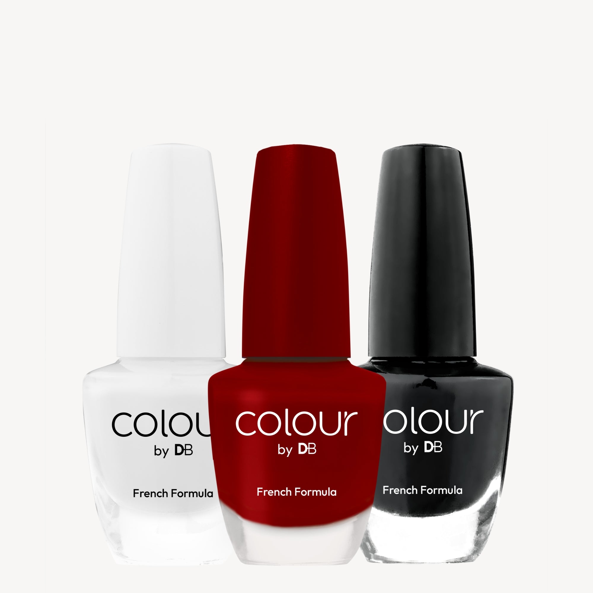 Three nail polish bottles on a white background: white, red, and black, branded "Colour by DB" with a French formula label.