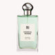 Perfume bottle labeled 'Coastal Woods' by DB on a white background