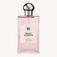 Elegant glass bottle of Peony Gardens Eau de Parfum with pink liquid and chrome cap. Luxurious fragrance by Dreamer's Brands Australia, 100ml.