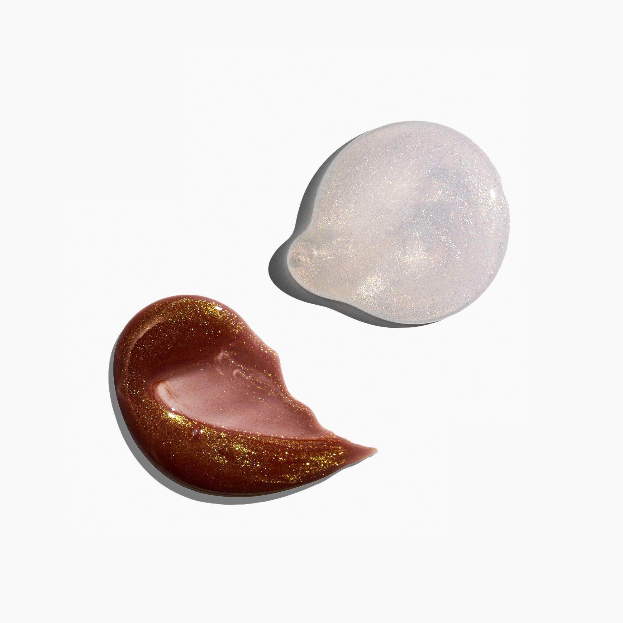 Two cosmetic product swatches on a white background, one gold and one clear.