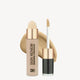 Luxury concealer with sponge applicator and brush, featuring a gold cap against a neutral background. Ideal for flawless, high-end skincare.