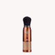 Makeup brush with a brown handle and black bristles on a white background