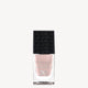 Elegant DB Infinite Gloss Longwear Nail Polish in a sleek, clear bottle with a black embossed cap. Soft, neutral pink shade. Perfect for luxury styling.